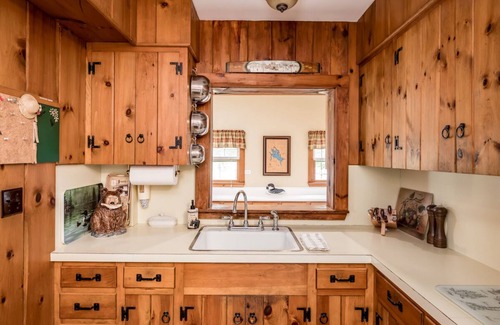 Melvin Village House | Waterfront home with boat dock, screened-in porch, large deck