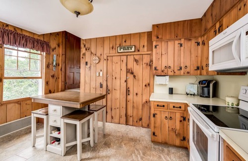 Melvin Village House | Waterfront home with boat dock, screened-in porch, large deck