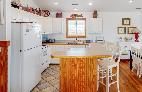 Hatteras House | Waterfront house near beach access with AC, private pool & hot tub -dog-friendly