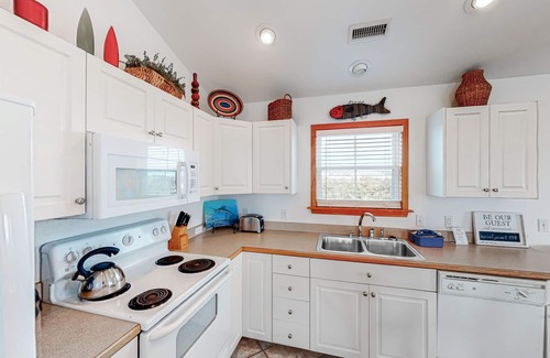 Hatteras House | Waterfront house near beach access with AC, private pool & hot tub -dog-friendly