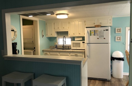 Surfside Beach Cottage | Waterfront, Large deck, Pet friendly, Golf cart, Screened in porch.