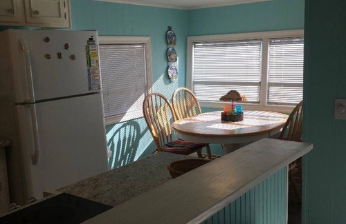 Surfside Beach Cottage | Waterfront, Large deck, Pet friendly, Golf cart, Screened in porch.