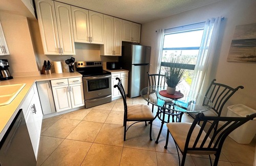 Marco Island Condo | Waterfront living at this Cheerfully decorated river view Condo.
