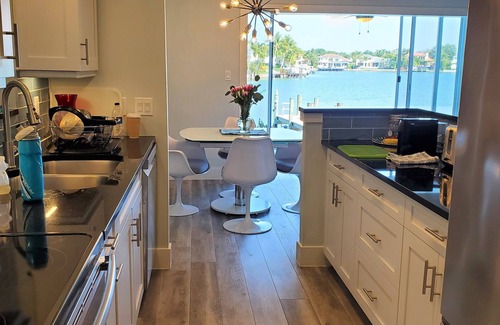 Moorings Condo | Waterfront- Newly Renovated walk out to Bay & Steps to Beach 2BR/2Ba