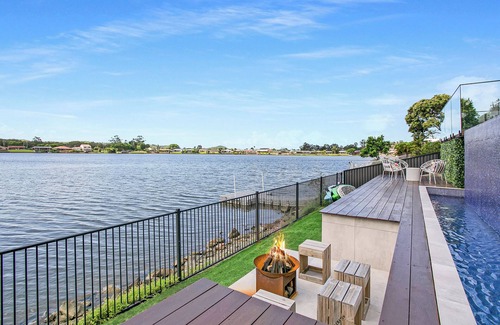 Elanora House | Waterfront Retreat with Infinity Pool & Canal Views