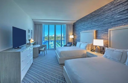 Central Beach Hotel | Waterfront Sanctuary: Marina Balcony, Pool, Easy Access to Water Taxi