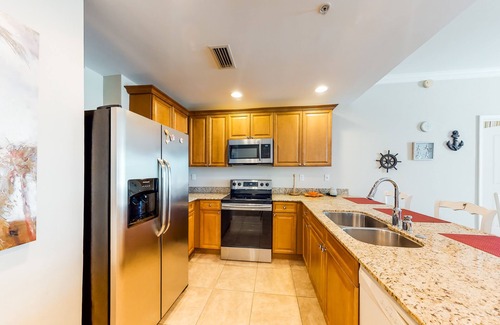 Upper Grand Lagoon Condo | Waterfront Snowbird retreat with private balcony & pool - near the beach