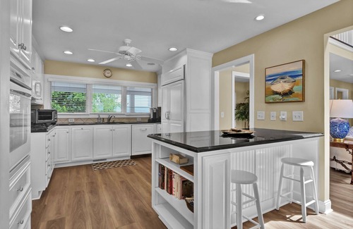 Shell Island House | Waterfront Retreat steps from Beach Access, 2 Boat Slips, Hot Tub & Elevator