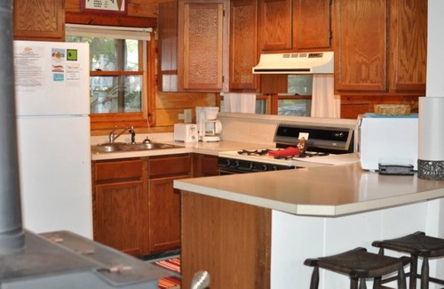 Tranquil Harbour House | Wateroak shaded home with screened porch one direct block from beach