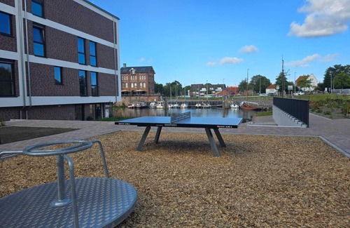 Suderneuland I Apartment | Weiße Düne - stylish living comfort with sauna & balcony at the Norder Marina
