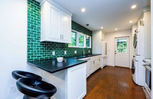 Benton Harbor Apartment | Welcome to a one-of-a-kind getaway in this modern and thoughtfully designed container home. Nestled in a quiet, wooded lot within Benton Harbor, the home offers a peaceful retreat just minutes from the beaches of Lake Michigan and charming shops