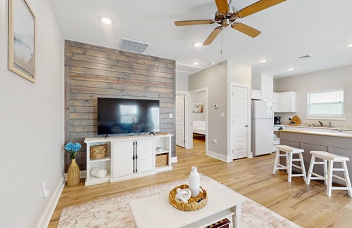 Fulton House | Welcoming coastal home with shared pool, stocked fishing pond - kitchen & patio