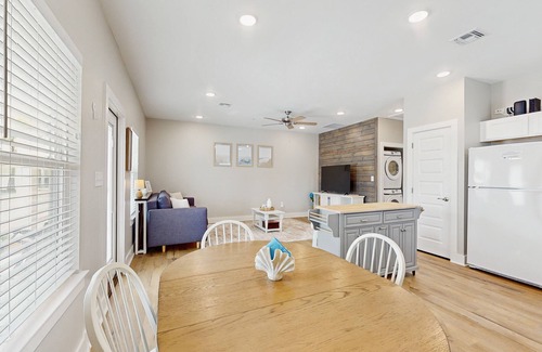 Fulton House | Welcoming coastal home with shared pool, stocked fishing pond - kitchen & patio