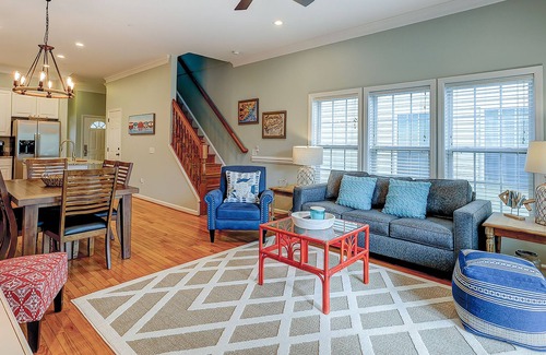 Waters Edge House | Welcoming water view townhome with pool, balcony, deck, & kitchen