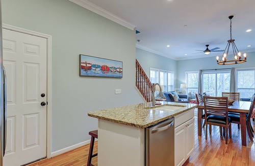Waters Edge House | Welcoming water view townhome with pool, balcony, deck, & kitchen