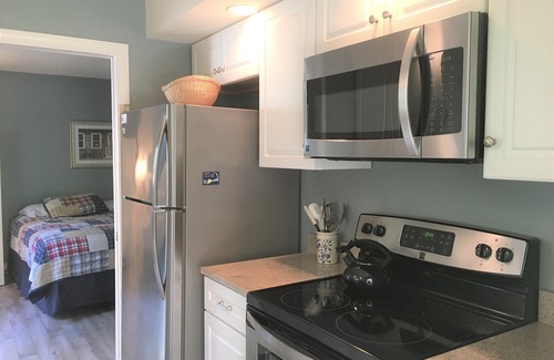 Brewster Condo | Well decorated luxury garden apartment with 3 private decks and spectacular golf course views!