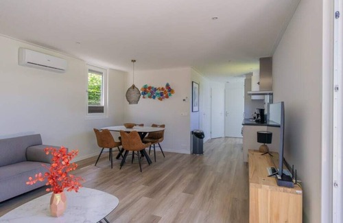 Burgh-Haamstede House | What immediately catches your eye upon entering is the garden-oriented living room with open kitchen