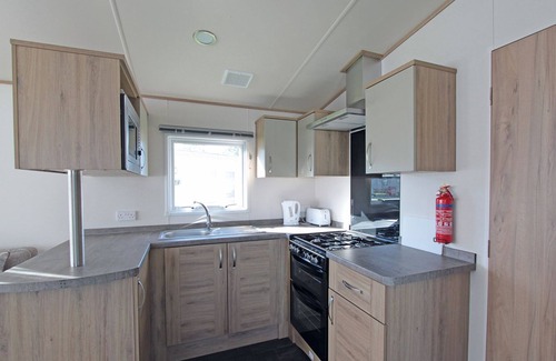 Alford House | Wheelchair friendly caravan with one double and one twin.