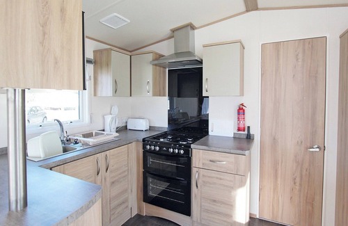 Alford House | Wheelchair friendly caravan with one double and one twin.