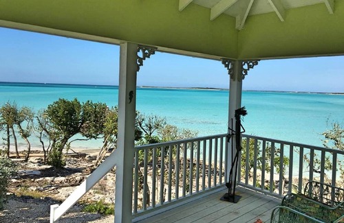 Clarence Town Cottage | Whistling Duck a Romantic, Private, Oceanfront One KING Bedroom Cottage.