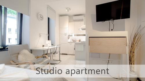 Old Town Apartment | White Apartments with AC by Kovee