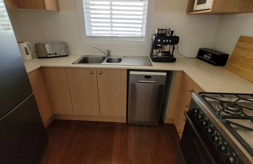 Port Macquarie House | Whole House WiFi Sundecks. Walk to Flynn's Beach + Dining. Family + Dog Friendly