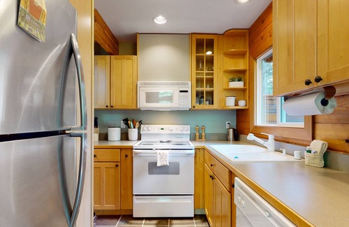 Sudden Valley House | Wilderness retreat on a double lot with a fireplace, large deck, & W/D