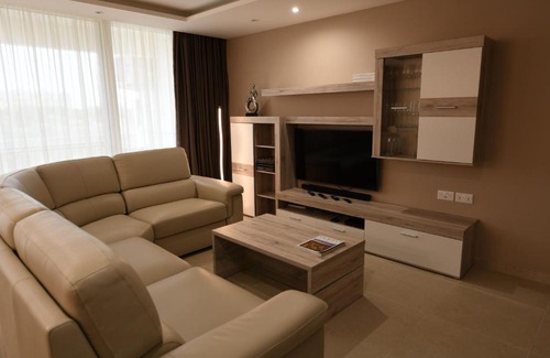 Qala Apartment | Wileg 4B Luxury Two Bedroom Apartment with Shared Swimming Pool.