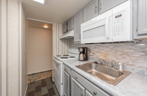 Thayerville Condo | Will O' The Wisp 304C: Lakefront One Bedroom Condo with Fireplace & Balcony!