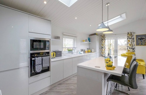 Carnforth Ski Chalet | Wine Down Retreat is a distinctive and luxurious lodge on Docker Holiday Park.