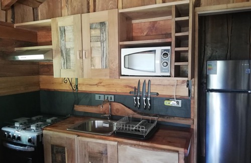 Pucon House | Wonderful rustic cabin 2, with native logs, on the banks of the Trancura River