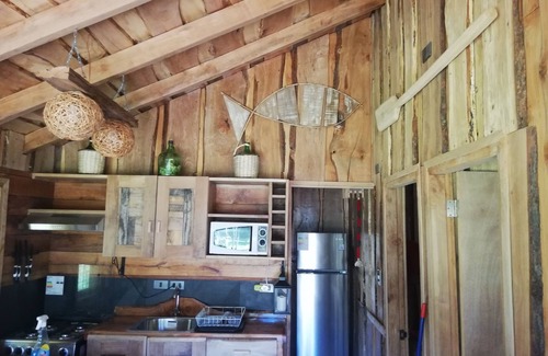 Pucon House | Wonderful rustic cabin 2, with native logs, on the banks of the Trancura River