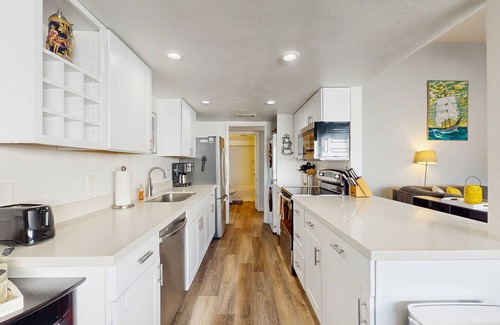 The Lakes Condo | Wonderful waterfront condo with pool, private balcony & fast WiFi - dog-friendly