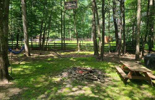 Paupack House | Wooded Retreat: 3 Bed/2 Bath, Hot Tub, A/C, Fire Pit, Ping Pong + Yard Games