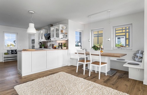 Olpenitz House | Wooden holiday home "Bootshaus" with sauna, bathing jetty and south-facing terrace with Baltic Sea view
