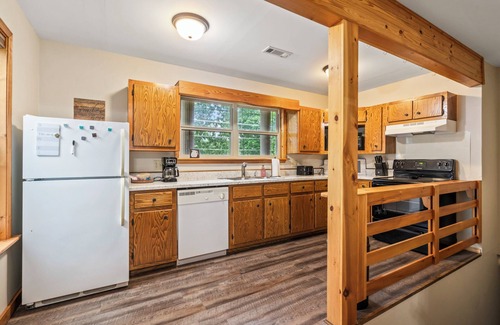 Kansas House | Woodland Escape, A rustic Charm meets Modern comfort in this 2BR 2BA home.