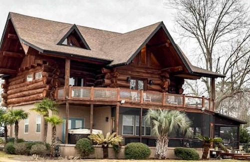 Manning House | Wyboo Lakefront Premier: Log Cabin on the Water!