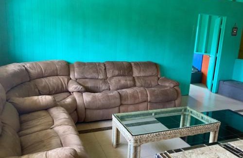 Mountain View Apartment | yellow house in tropical forest