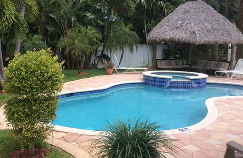 Boca Raton House | YOUR HOME IN BOCA RATON with heated pool and Spa Private backyard and tiki hut
