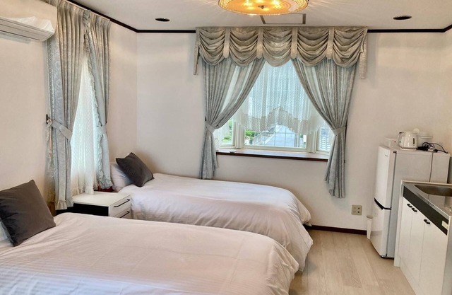 A triple room with a spectacular oceanfront view sunset right in front of you and plenty of amenit/Hamada Shimane
