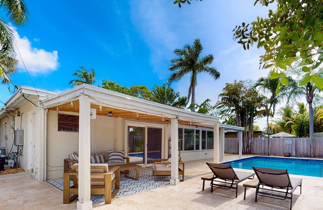 Adorable bungalow with an enclosed yard, private pool, grill, firepit, W/D, & AC