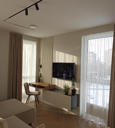 Apartments with a balcony and an impressive terrace on the roof of the house