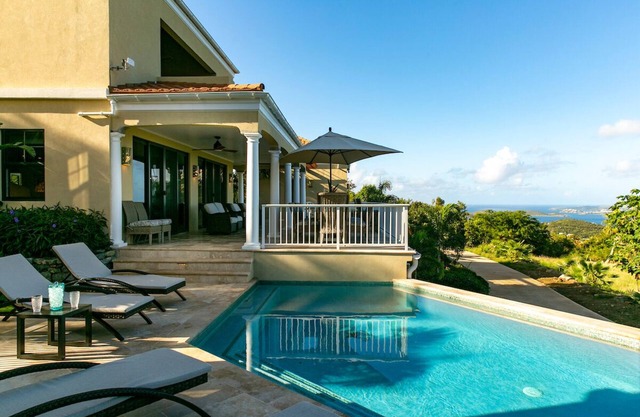 Ard Na Mara,"high above the sea", perched high above Cruz Bay with sunset views.