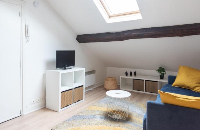 Attic apartment with exposed beams