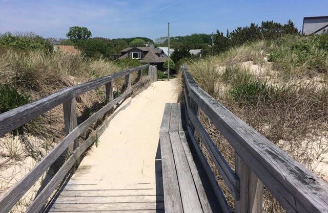 Beachfront Cottage Nestled Behind Dunes Just Steps Away From The Beach.