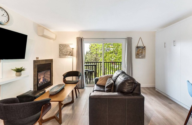 Beautifully Remodeled top floor condo with two balconies, a fireplace and BBQ!