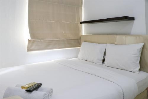 Best Price and Strategic 2BR Green Bay Pluit Apartment By Travelio