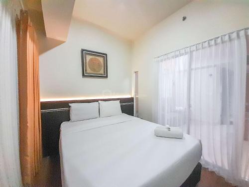 Brand New and Good Simply 1BR at Uttara The Icon Apartment By Travelio