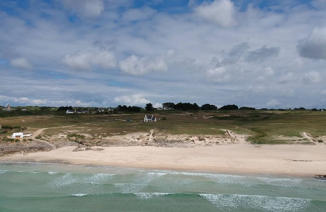 Breton house by the ocean in the dunes of Trez Goarem