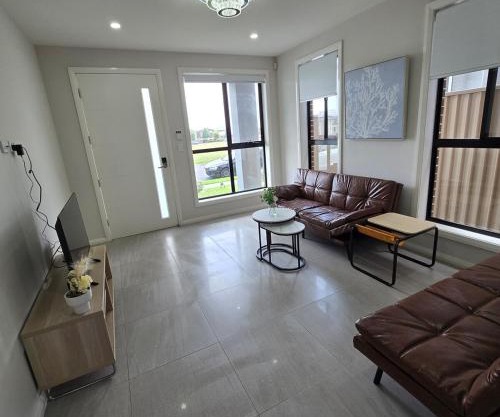 Center of Rouse Hill house with back yd